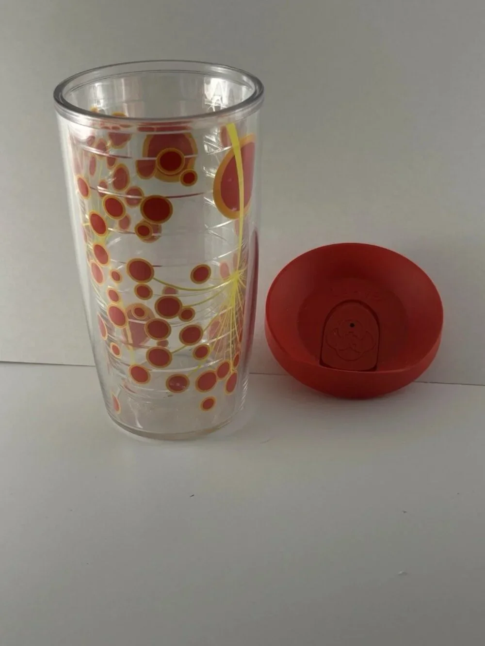 Tervis Tumbler 16 oz Red And Yellow Dandelion Seeds With Red Lid